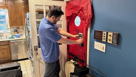 The latest blower door test at my house, with Alex DeSpain at the controls